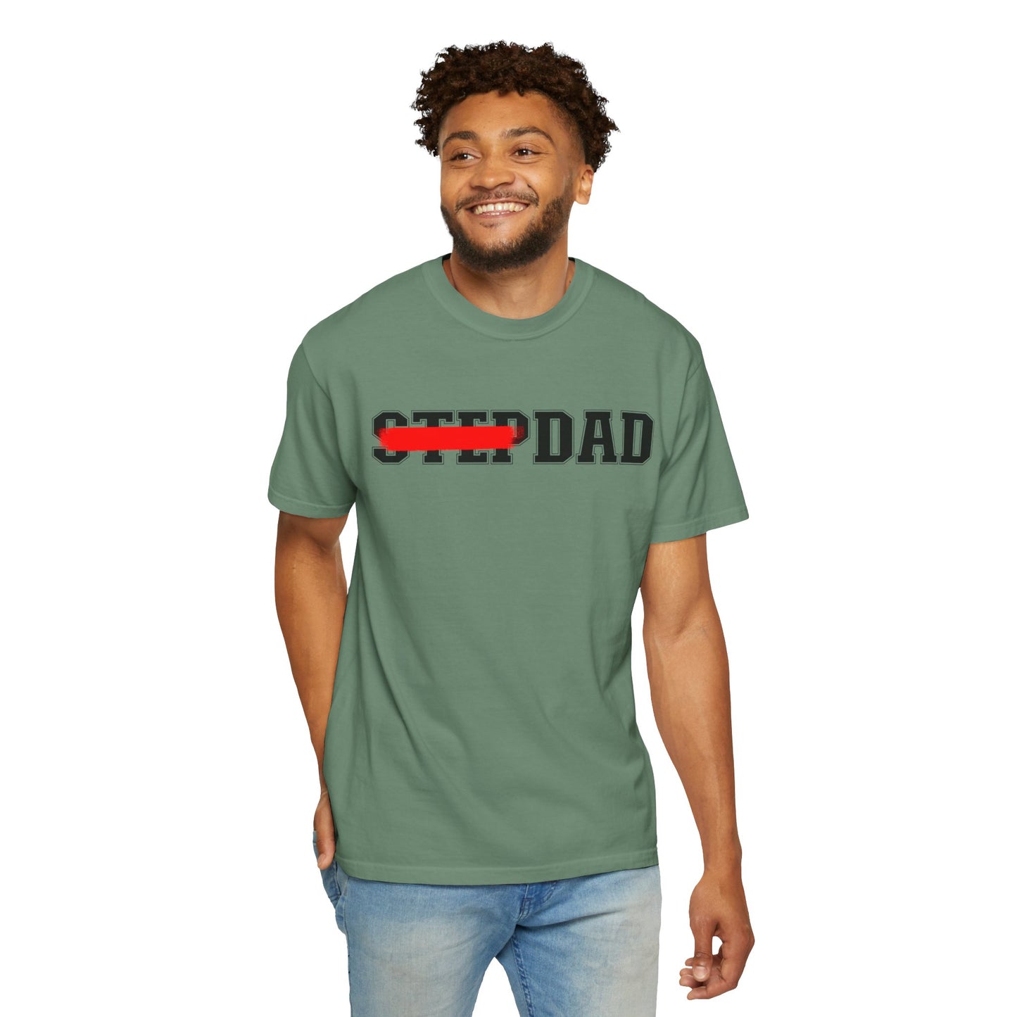A green t-shirt with black 'STEP DAD' text across the chest, the word 'STEP' is crossed out with a red line so only 'DAD' is easily readable.