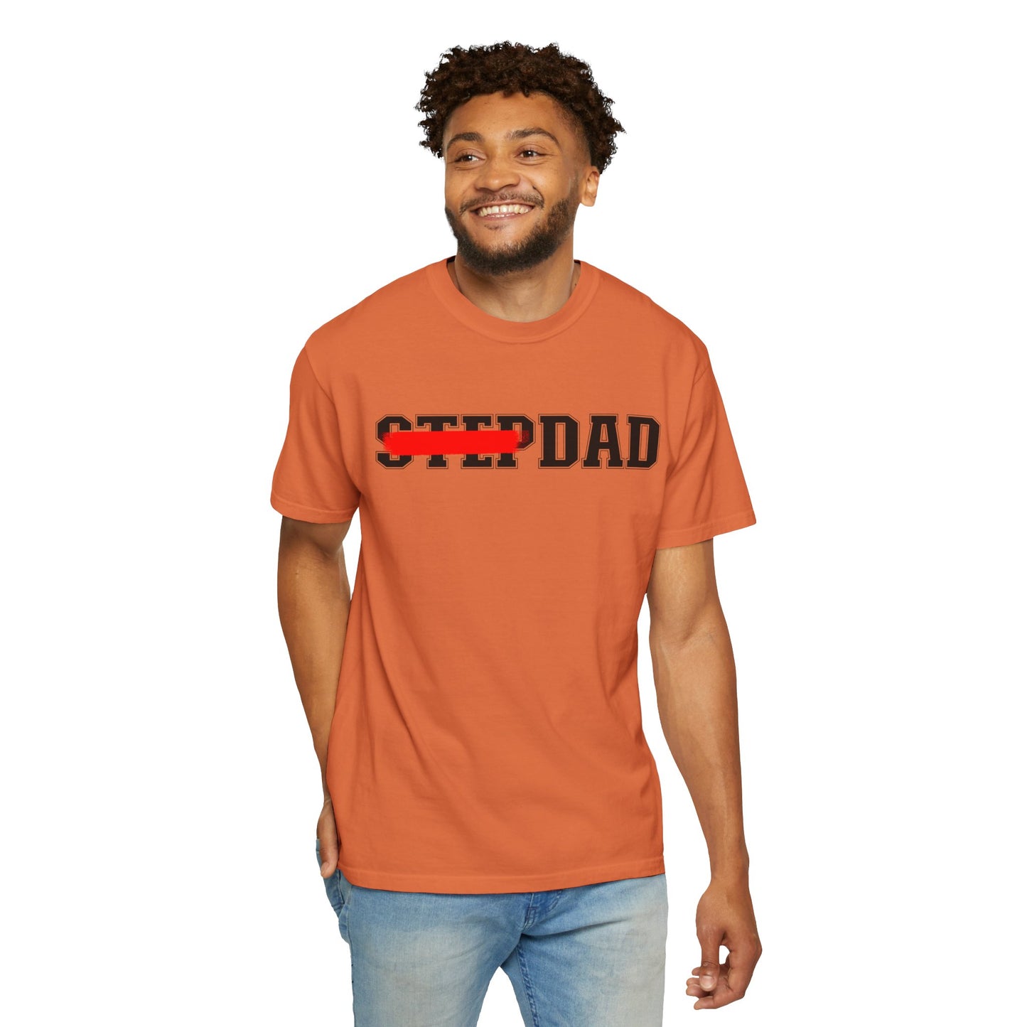 An orange t-shirt with black 'STEP DAD' text across the chest, the word 'STEP' is crossed out with a red line so only 'DAD' is easily readable.