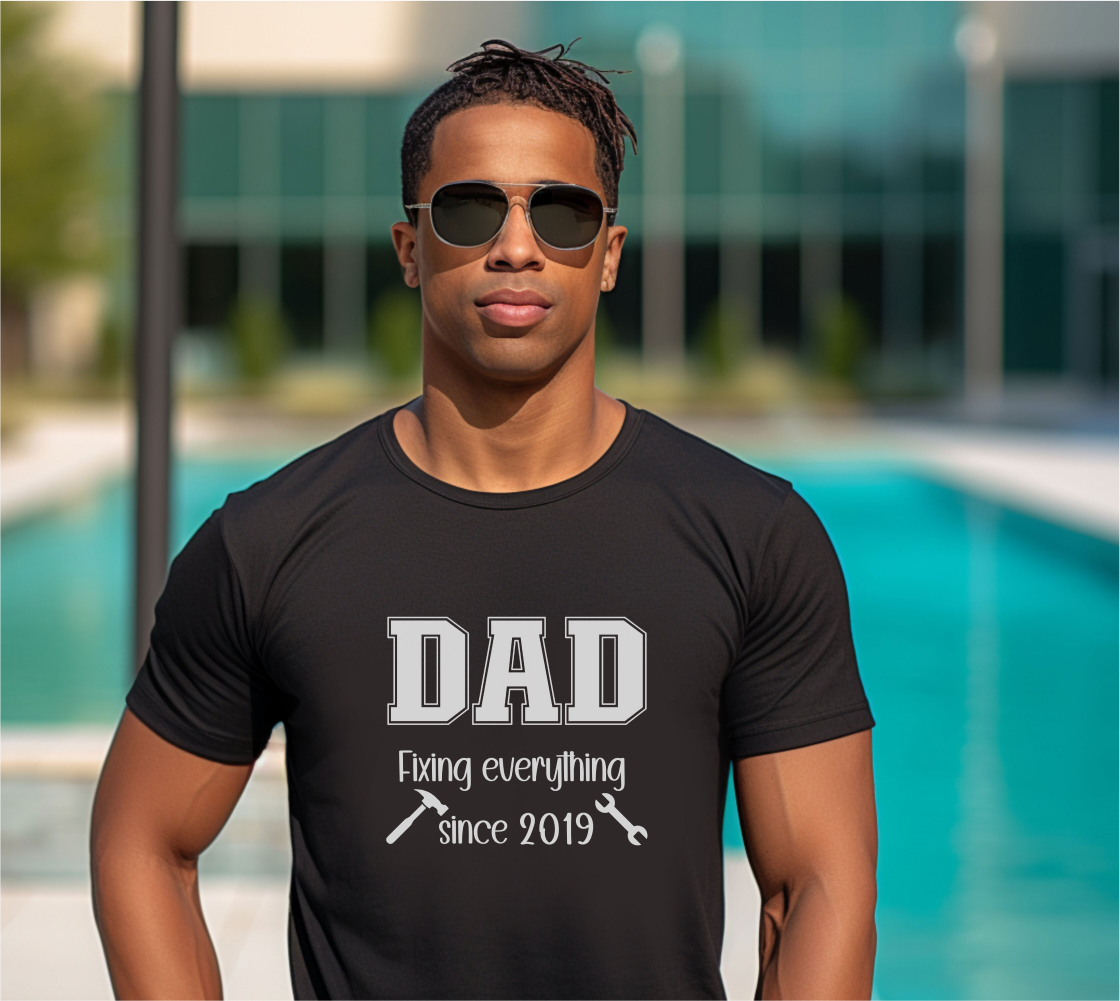 Customizable year, black t-shirt with 'DAD fixing everything since 2019' in white text with a small hammer and wrench graphic included.