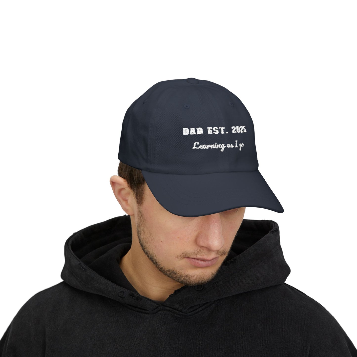 Customizable year, Navy blue cap with text 'DAD EST. 2025 Learning as I go' in a white text