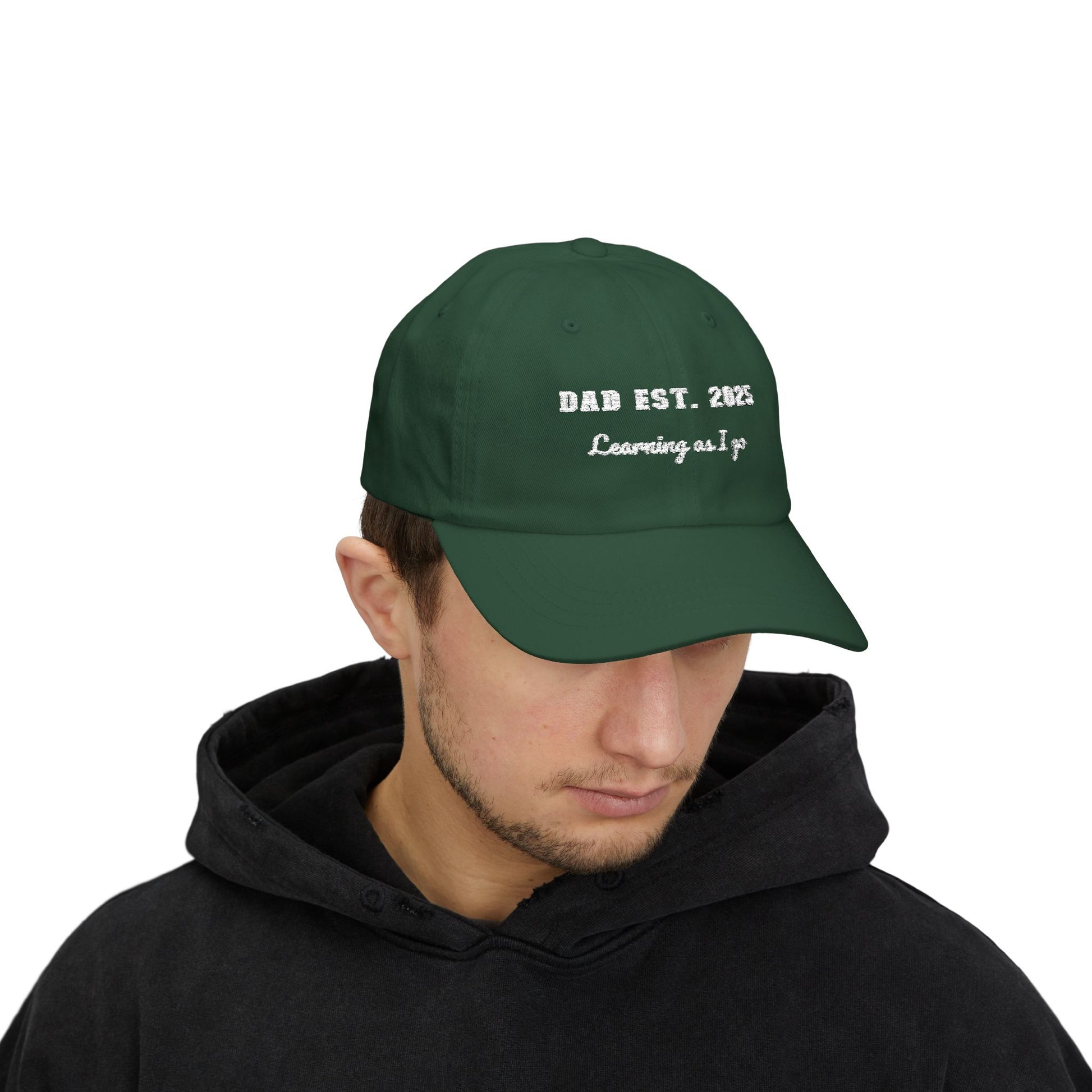 Customizable year, Green cap with text 'DAD EST. 2025 Learning as I go' in a white text