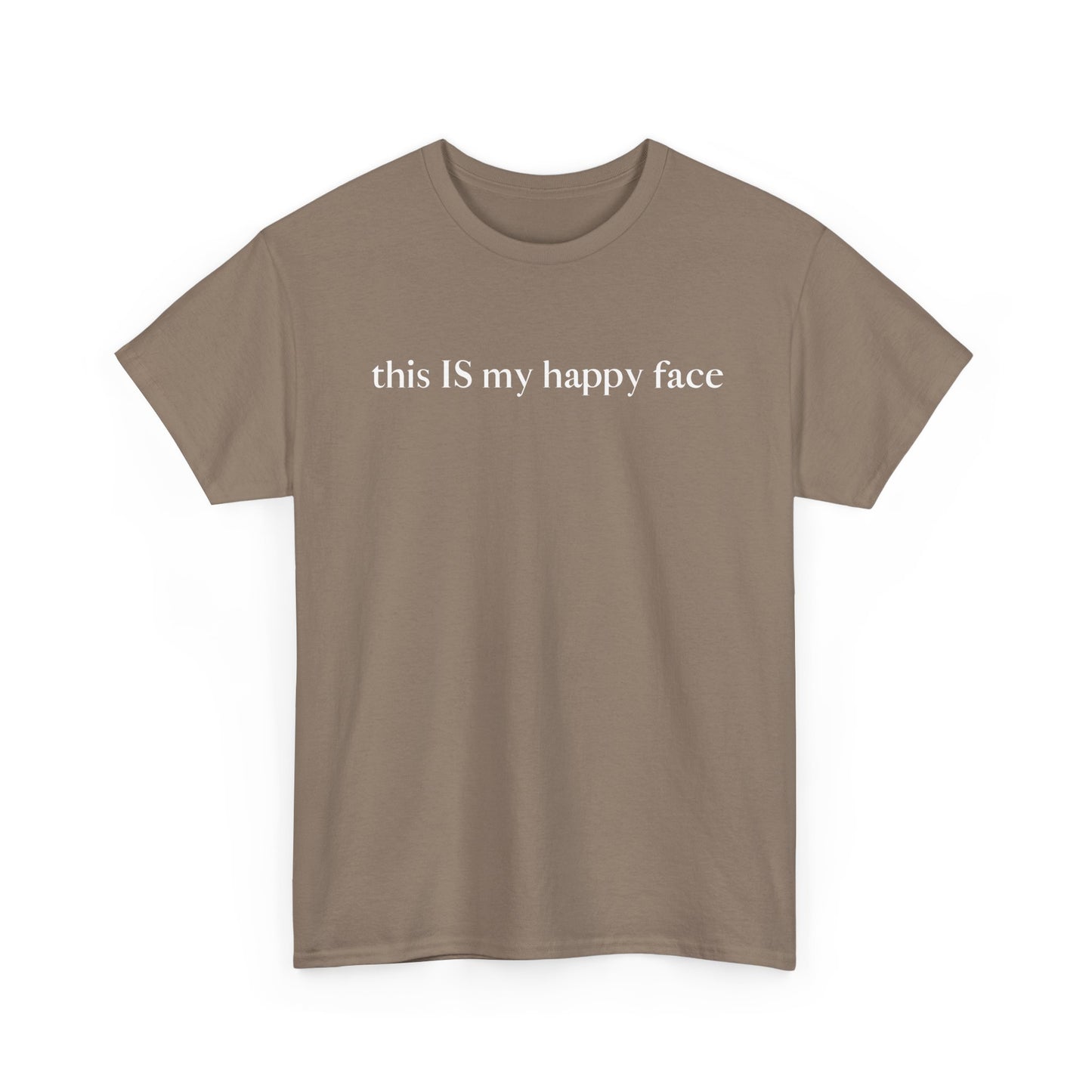 A brown unisex cotton t-shirt with the text 'this IS my happy face' printed in white across the chest. All characters are lower case except the word 'IS' which are in capital letters.