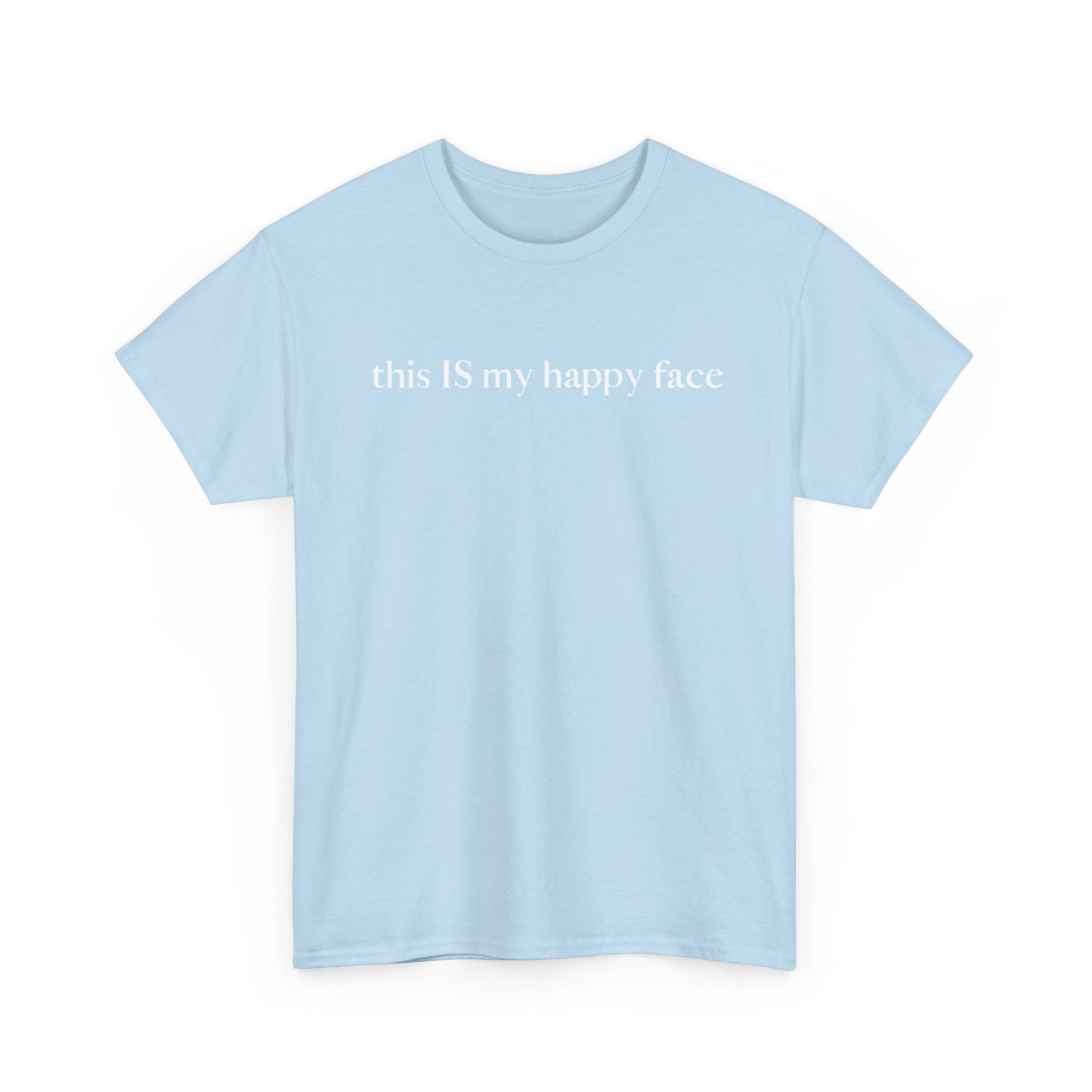 A light blue unisex cotton t-shirt with the text 'this IS my happy face' printed in white across the chest. All characters are lower case except the word 'IS' which are in capital letters.
